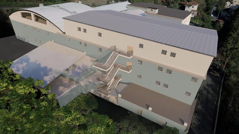 Riconversione di un ex complesso industriale di 6.700 m2: riqualificazione edilizia e impiantistica di magazzini e uffici, con modifiche ai prospetti in zona a vincolo paesaggistico, via Trieste.